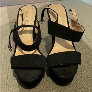 high heeled black sandals